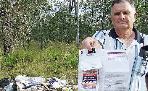 Allan Fuary discovered identification papers in a pile of dumped rubbish at Wongi State Forest – the offender was ordered to clean up the mess and was fined $300 by DERM. Allan Fuary discovered identification papers in a pile of dumped rubbish at Wongi State Forest – the offender was ordered to clean up the mess and was fined $300 by DERM.